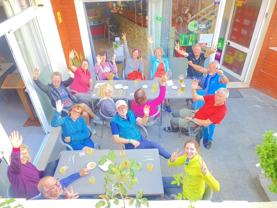 A happy table of guests on the terrace at Sabores da Andreia