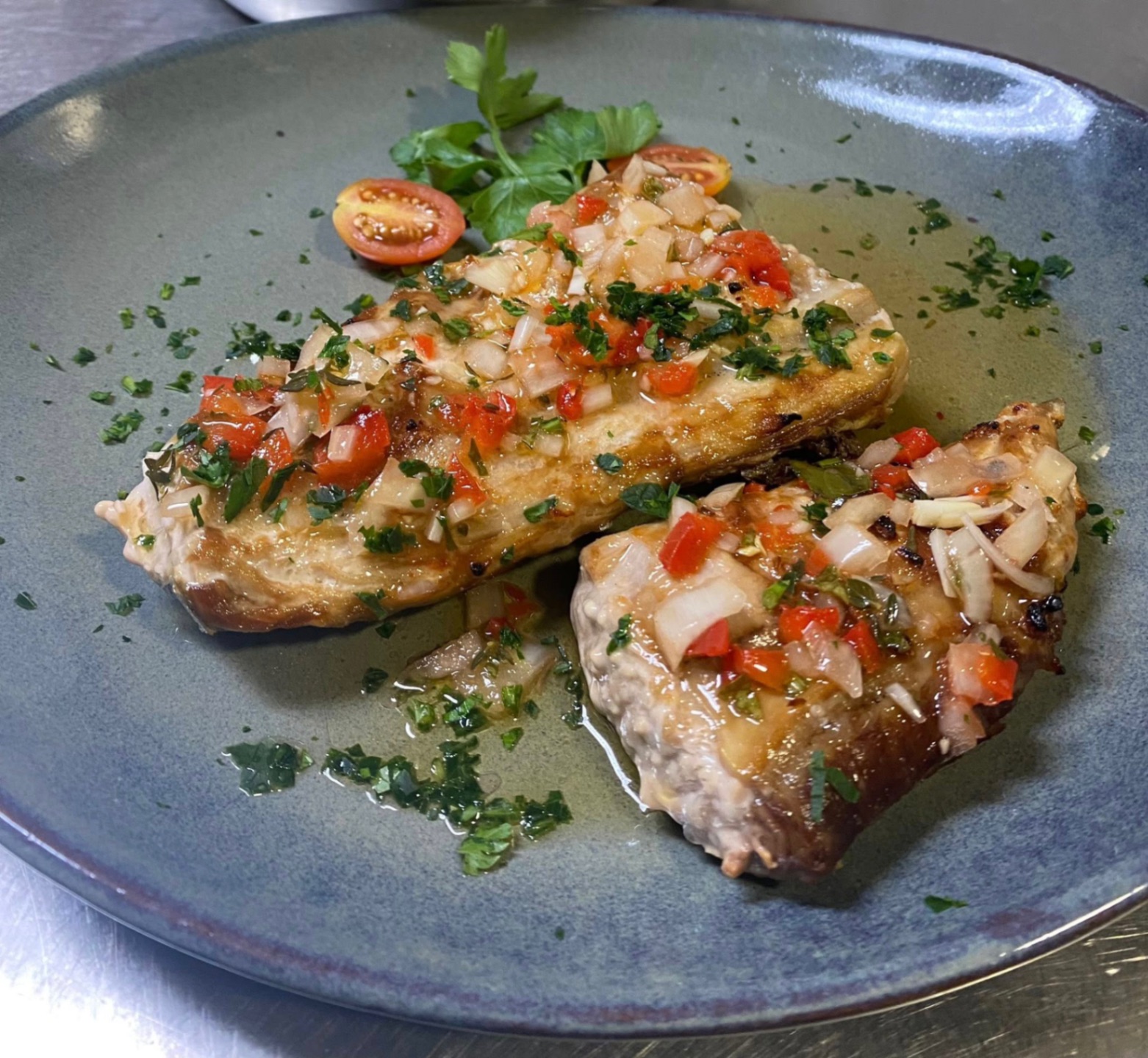 Grilled chicken fillets topped with fresh tomato, onion and pepper salsa